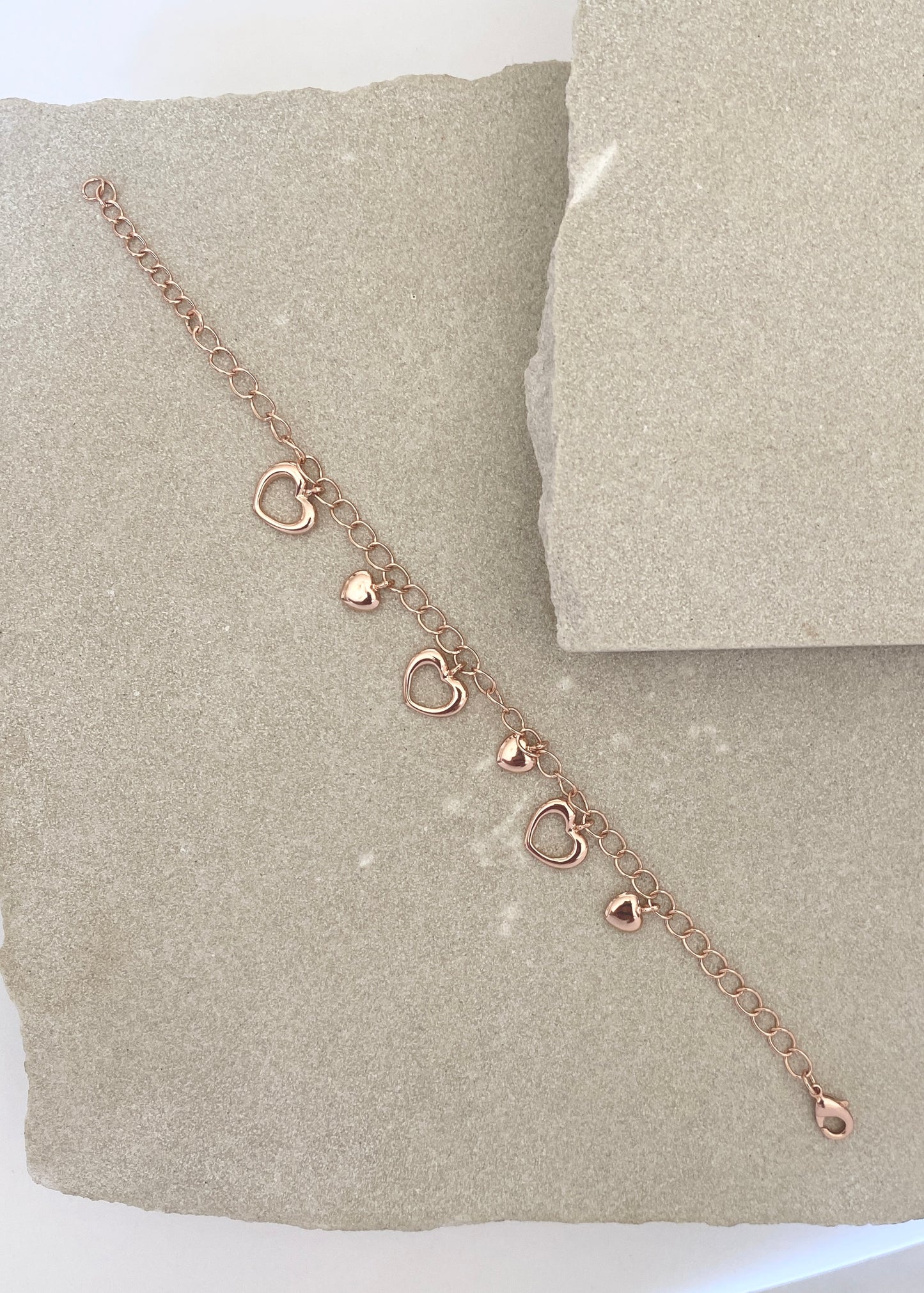 Rose gold and silver hearts bracelet